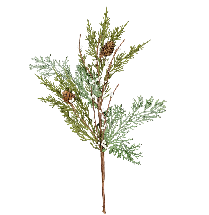 Decorative branch with green leaves and small white flowers on a dark wooden background