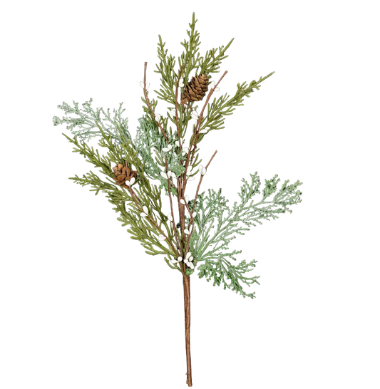 Decorative branch with green leaves and small white flowers on a dark wooden background